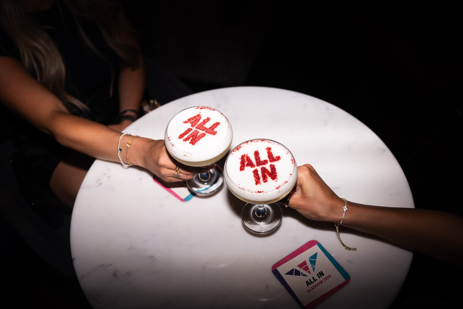 Two All In stencilled cocktails shared over a table